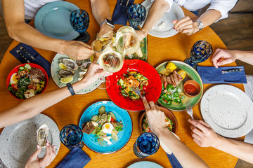 friends having lunch at a restaurant and having fun