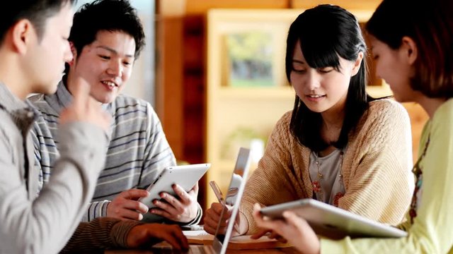 Close up of young people studying together
