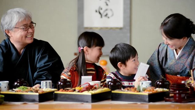 Close up of family having traditional Japanese New Years meal