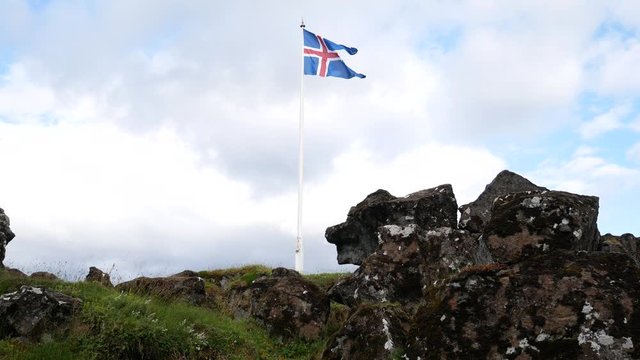 Thingvellir National Park, Iceland:  the Icelandic flag flies in  Tingvellir. The Mid-Atlantic Ridge and the boundary between the North American and Eurasian tectonic plates. A rift valley.