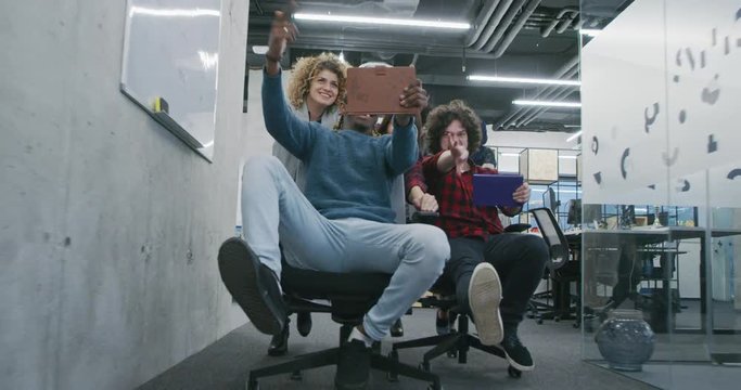 Young multiethnic business team of software developers working together using