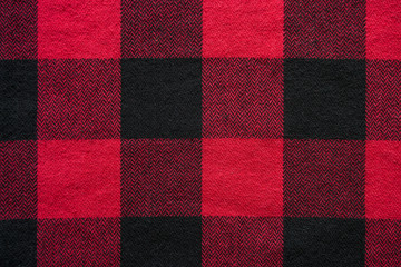 Black and Red Fabric in a Cage. Plaid material. Clothes background