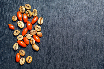 Fototapeta na wymiar fresh berries of red goji and seed of coffee