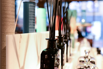 Black reed scent sticks in bottles with different aromatic fragrances