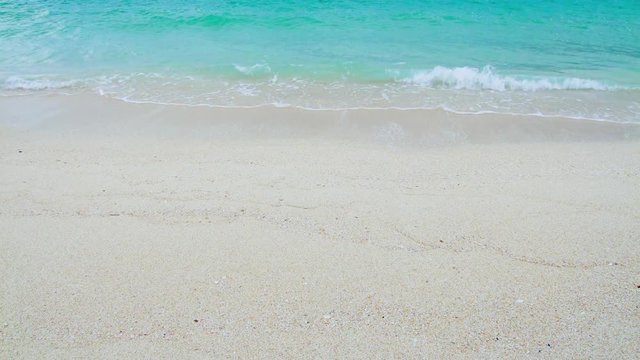 Sandy beach and waves in sea, Japan