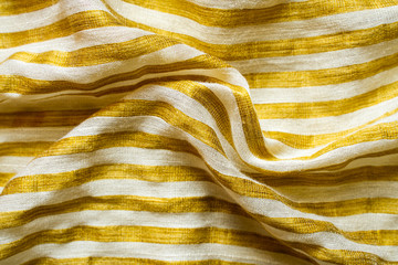 Yellow-White Striped Fabric Background. Gold Metallic Thread Striped Knitted Fabric