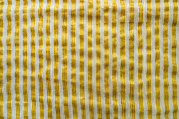 Yellow-White Striped Fabric Background. Gold Metallic Thread Striped Knitted Fabric