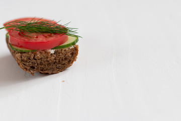 Healthy delicious sandwiches with rye bread and seasonal vegetables and cottage cheese for breakfast. With space for text