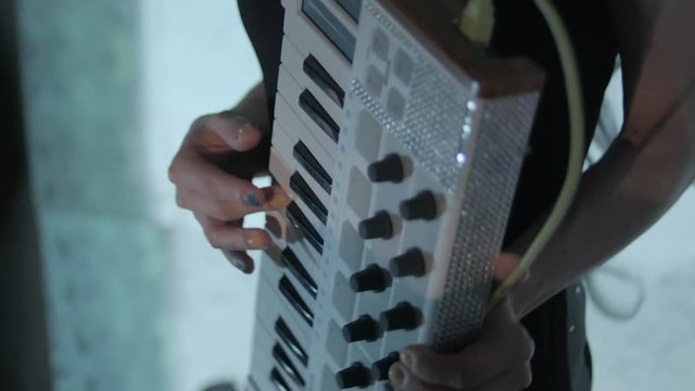 Woman playing synthesizer