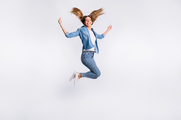 Full length size body photo of cheerful charming optimistic lady jumping up isolated grey background copyspace
