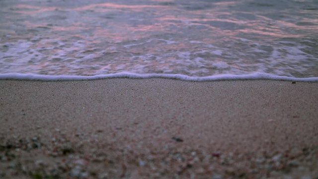 Close up of sand beach and waves, Ginowan, Okinawa Prefecture, Japan