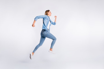 Full length body size photo of running fast energetic lady isolated grey background