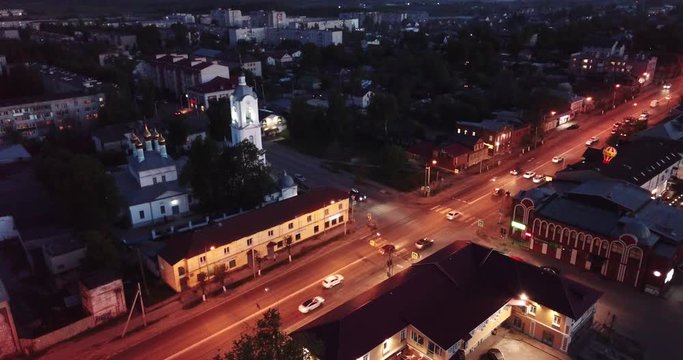 Night aerial view of Russian town of Pokrov with Cathedral of Intercession of Holy Virgin and busy M7 highway 