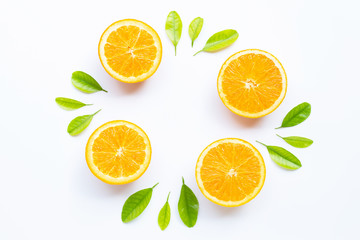 Naklejka na ściany i meble High vitamin C, Juicy and sweet. Fresh orange fruit with green leaves on white.