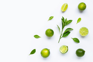 Limes with leaves isolated on white background.
