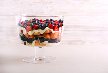 Mix berry and fruit trifle served - obrazy, fototapety, plakaty