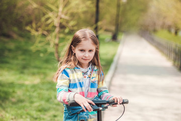 Little girl with scooter