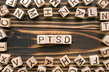 PTSD - word from wooden blocks with letters, abbreviation for post-traumatic stress disorder,...