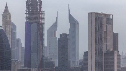 Dubai downtown skyline at morning aerial timelapse with traffic on highway