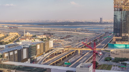 Aerial view of Financial center road timelapse with under construction building