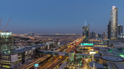 Aerial view of Financial center road day to night timelapse with under construction building