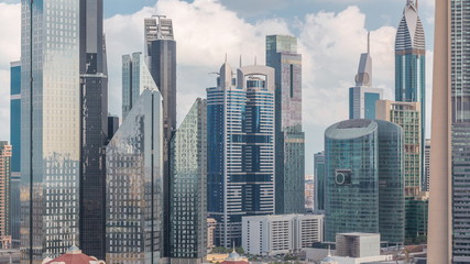 Aerial view on downtown and financial district in Dubai timelapse, United Arab Emirates with skyscrapers and highways.