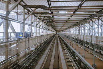 tunnel of monorail road view from front window of a moving train running
