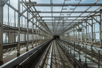 tunnel of monorail road view from front window of a moving train running