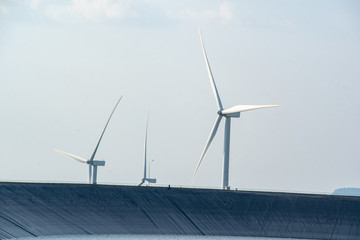 wind mill or also wind-turbine on wind in rotation to generate electricity energy,Wind turbine...