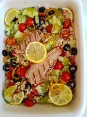 Fresh rice salad with vegetables and grilled tuna