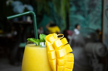 Refreshing mango smoothie in a glass, mango shake. tropical fruit concept