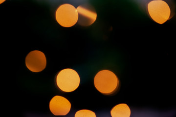 Outdoors Winter Christmas decoration concept: Light Garlands decorating the front of the building at night. Winter Holidays Tradition.