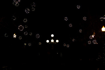 Outdoors Winter Christmas decoration concept: Light Garlands decorating the front of the building at night. Winter Holidays Tradition.