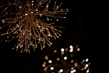 Outdoors Winter Christmas decoration concept: Light Garlands decorating the front of the building at night. Winter Holidays Tradition.