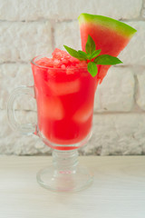 Refreshing watermelon smoothie on a white background.