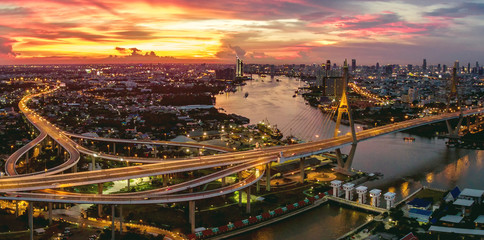 Naklejka premium aerial view of bhumibol bridge at dusk in bangkok thailand