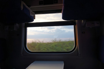 beautiful sunset view from the window of a train car