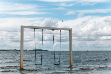 Swing on beautiful sea shore and beach, Sweden, Helsingborg