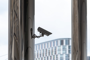 modern building in the city with a security camera on wall