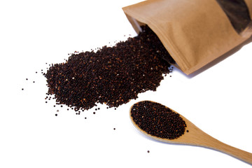 Raw brown seeds quinoa closeup isolated at white background