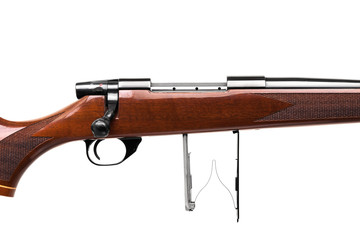 Modern luxury bolt-action carbine with a wooden varnished butt. Expensive hunting rifle isolate on...