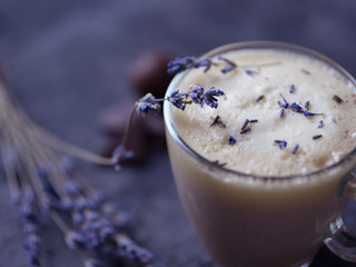 Homemade Cappuccino raf coffee with lavender . Cozy Breakfast. Lavender flowers and chocolate