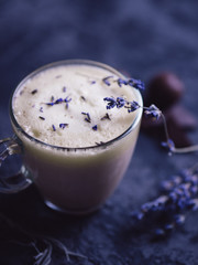 Homemade Cappuccino raf coffee with lavender . Cozy Breakfast. Lavender flowers and chocolate