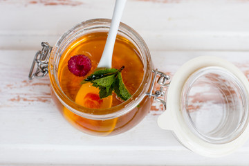 Savior of the honey feast, the harvest of honey. Honey in a glass jar