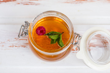 Savior of the honey feast, the harvest of honey. Honey in a glass jar