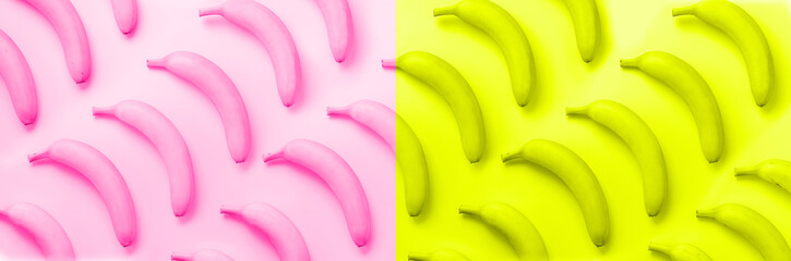 Chaotic colorful fruit pattern. Bananas over neon pink and yellow color background. Banner. Top view. Pop art design, creative summer concept. Minimal flat lay style.