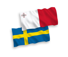 National vector fabric wave flags of Malta and Sweden isolated on white background. 1 to 2 proportion.