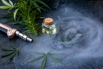 THC Oil Extract in Cartridge Close-up of Vaping Cannabis Isolated on Dark Background with Smoke