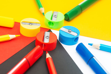 pencil and marker on colored background