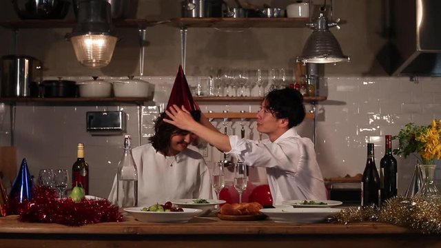 Couple wearing hats at party, Funabashi, Chiba Prefecture, Japan